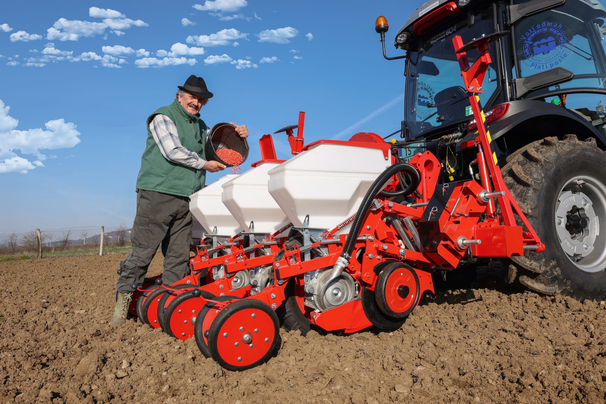 Filling seed into a Majevica pneumatic precision seed drill — preparing for sowing