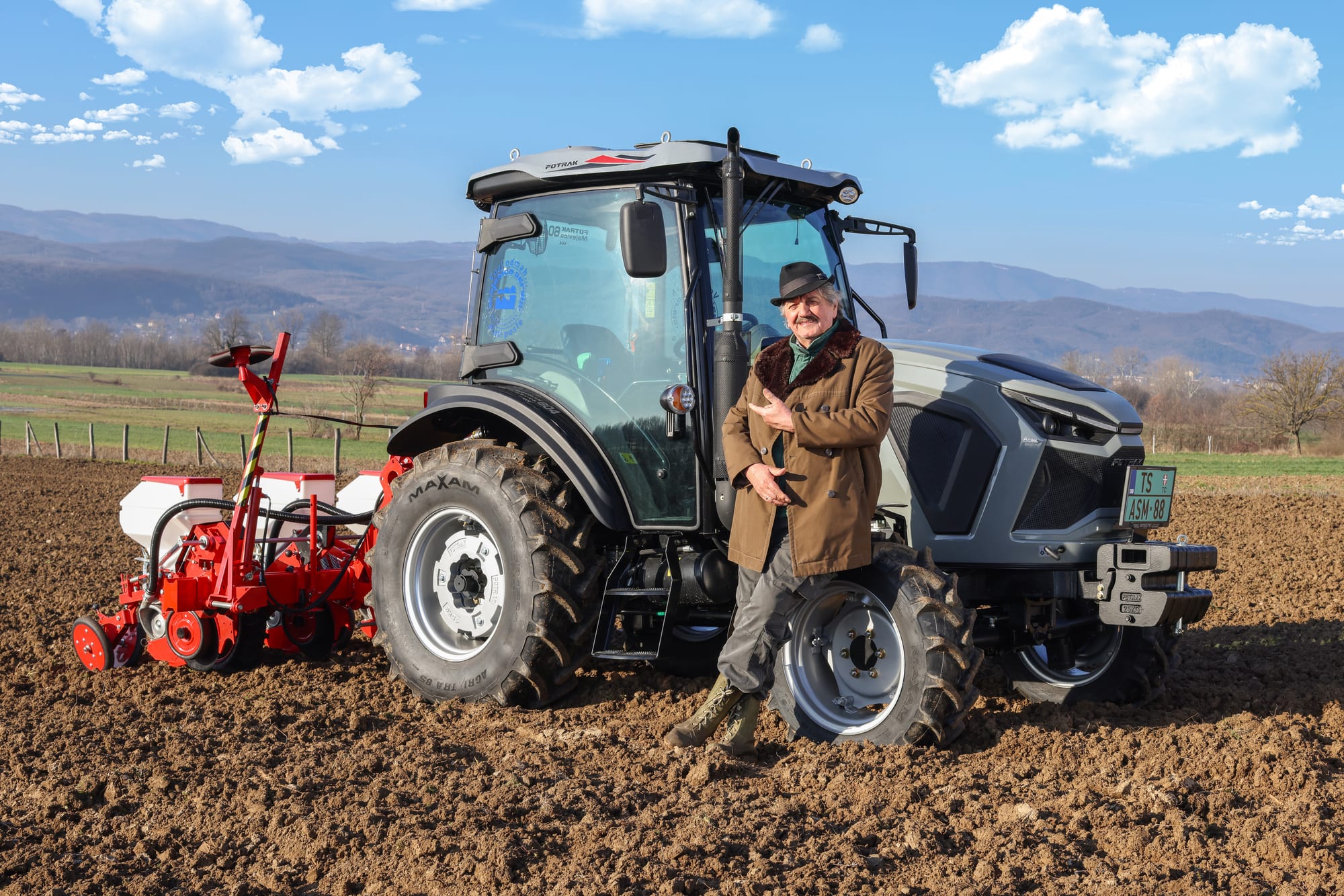 Tractor with a Majevica pneumatic precision seed drill in the field